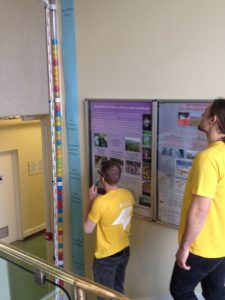 CBESS’s Ben Evans (far right) surveys the sea-level rise tower, the Festival’s log (‘pop a coloured ball in the tube and come on in’) of visitors to the Cambridge watery demonstrations. Here sea level approaches the level expected in New Orleans by 2416. In all, over 300 visitors experienced the coastal displays and demonstrations.